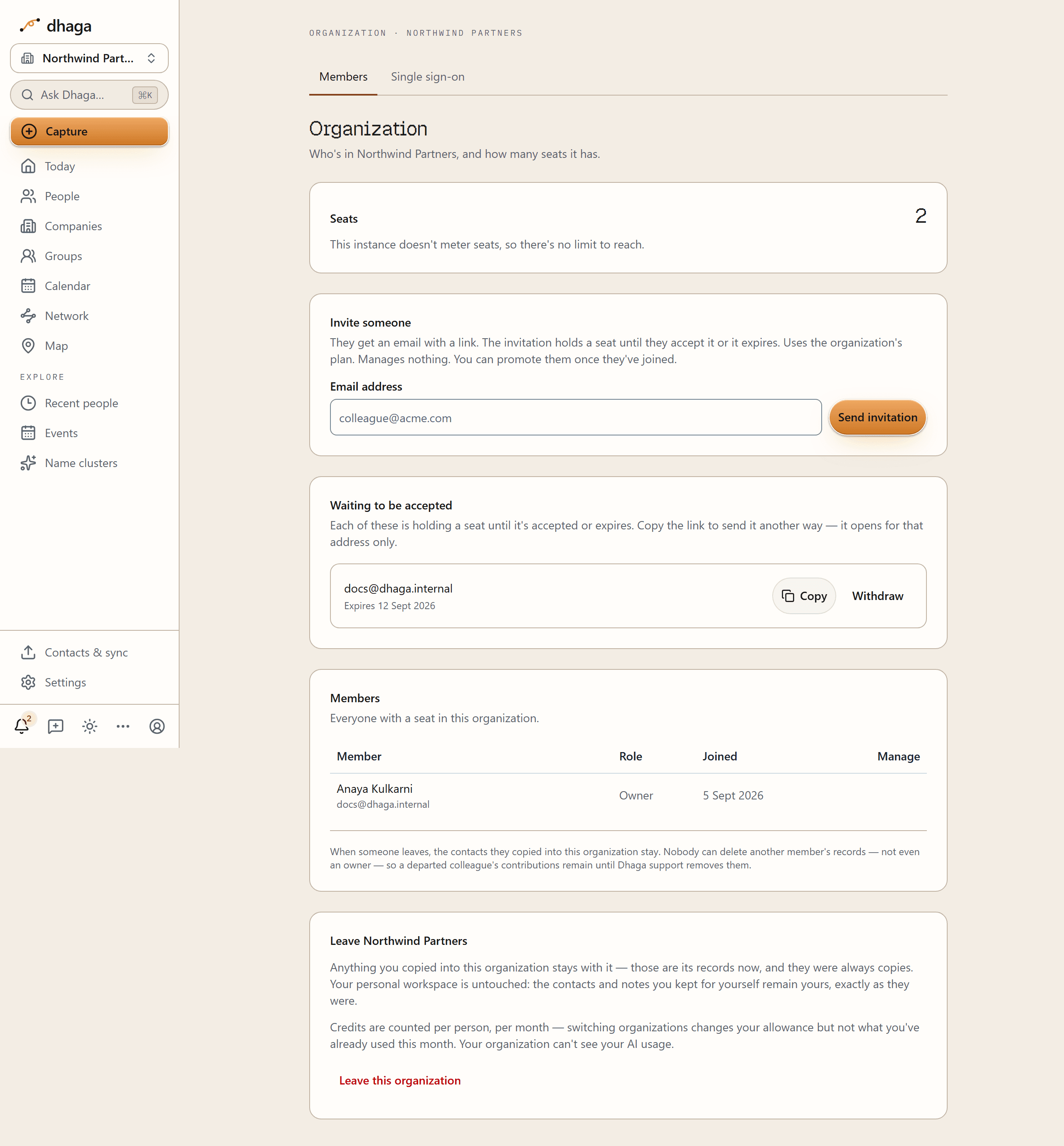 The Organization console: a seat count at the top, an Invite someone card with an email field and a Send invitation button, a Waiting to be accepted list with Copy and Withdraw beside a pending address, the members roster with each person's role and join date, and a Leave this organization control at the bottom